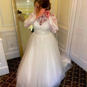 Demure and elegant lace sleeves and a Mandarin collar wedding gown
